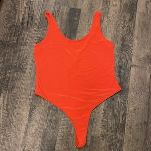 NWT Akira orange thong bodysuit!